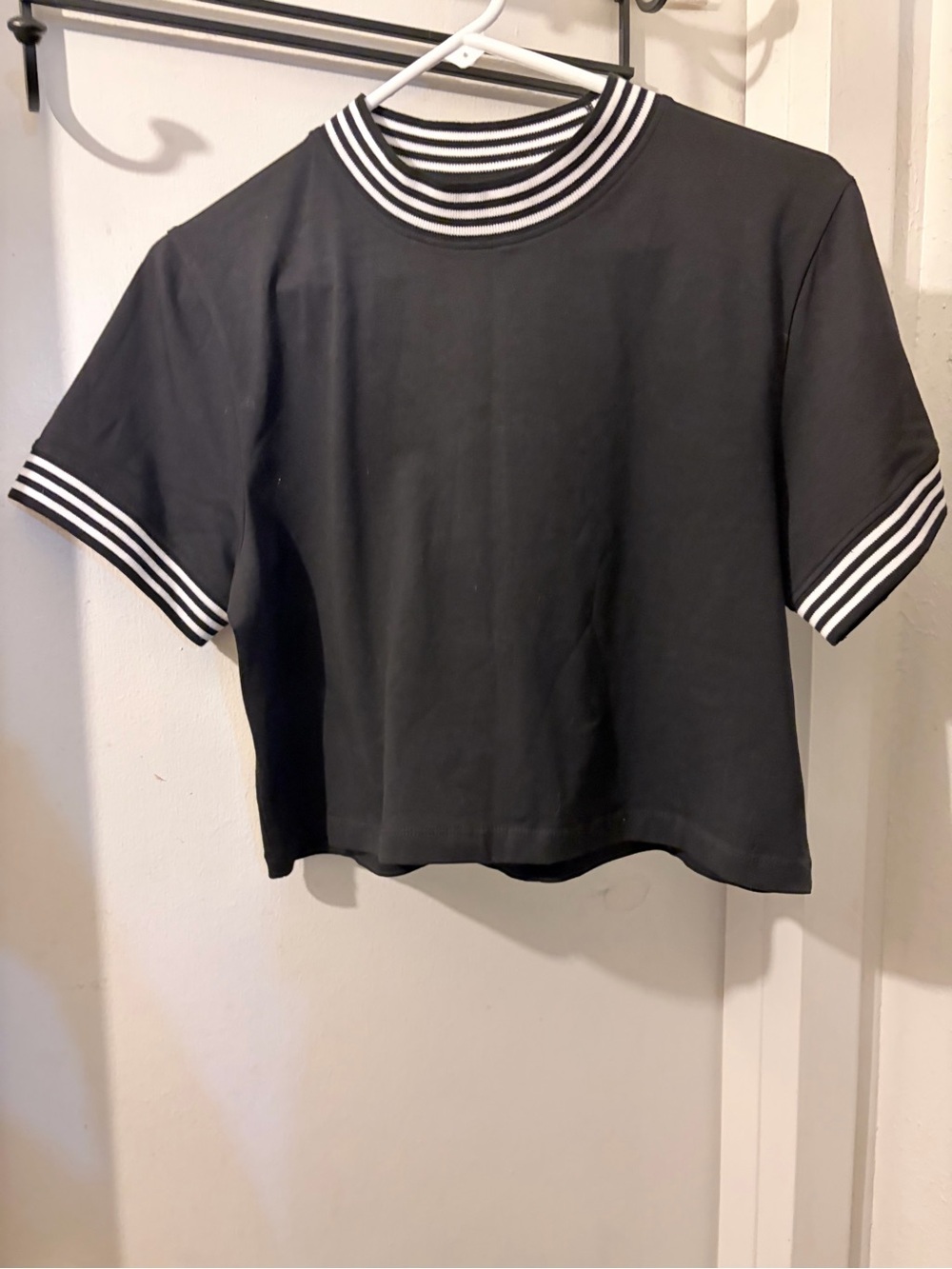 Disturbia-size UK18- black crop top with white striped trim. Soft and dark.